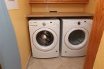 Laundry Room Features a Full Size Washer & Dryer